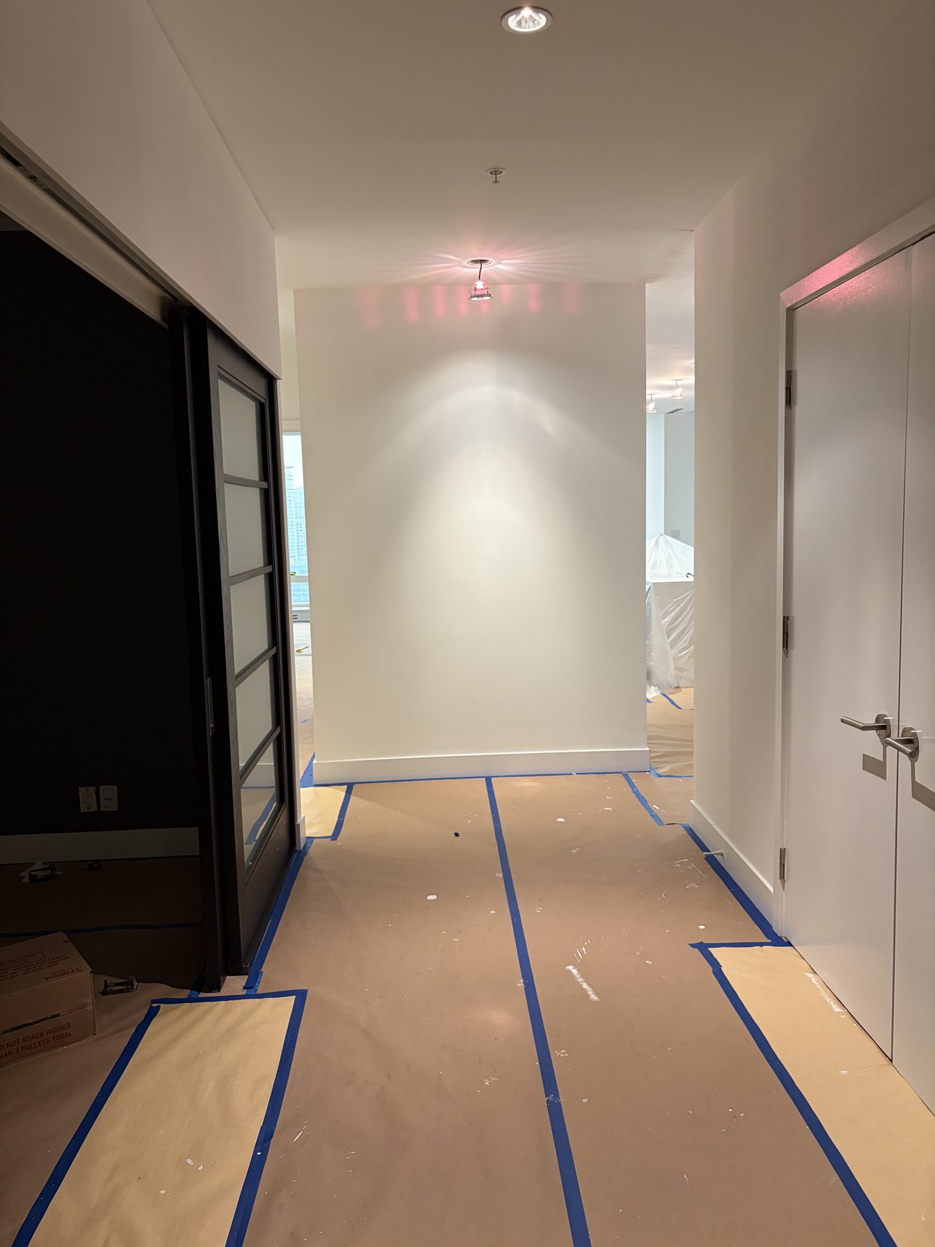 Hallway masked and protected before painting